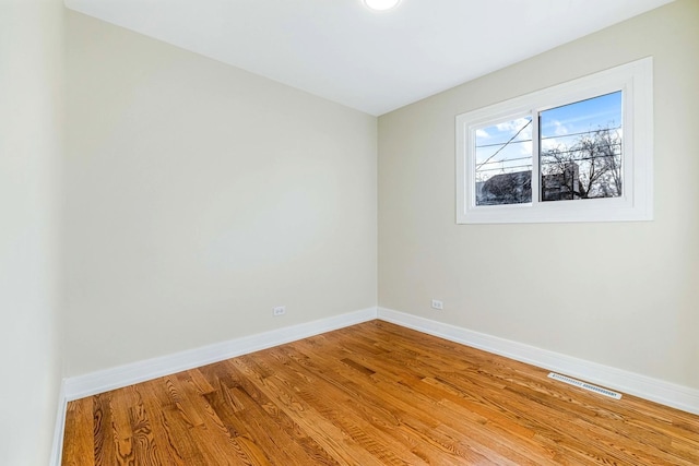 unfurnished room with light hardwood / wood-style flooring