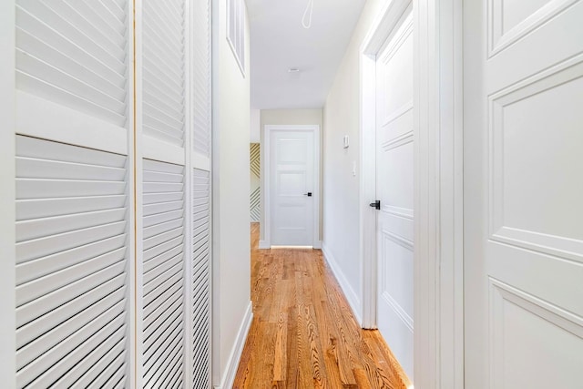 hall with light hardwood / wood-style floors