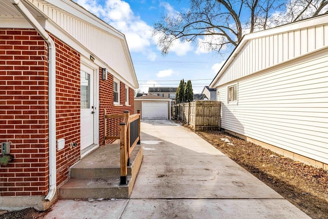 view of side of property featuring a garage and an outdoor structure