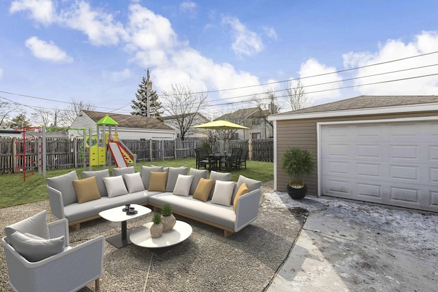 view of patio / terrace featuring a playground, a garage, an outdoor hangout area, and an outdoor structure