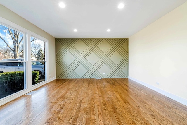 spare room featuring light wood-type flooring