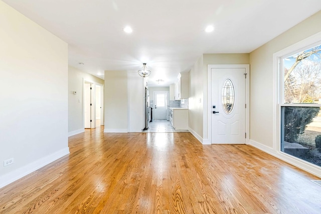 foyer with light hardwood / wood-style floors