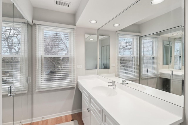 bathroom with vanity and hardwood / wood-style floors