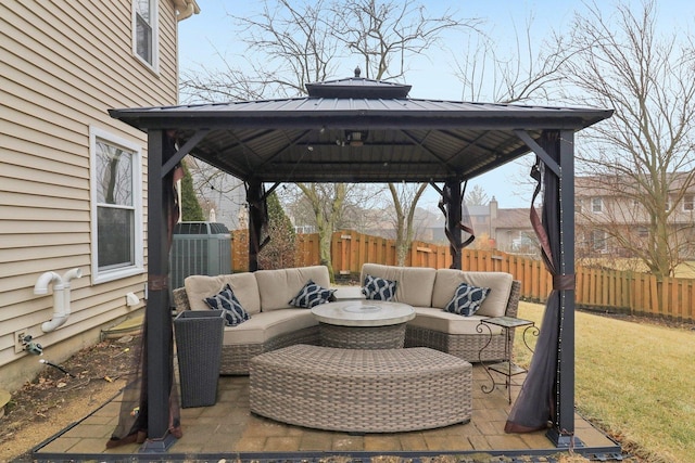 view of patio featuring an outdoor living space, a gazebo, and central AC