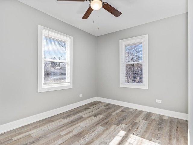 spare room with ceiling fan and light hardwood / wood-style floors