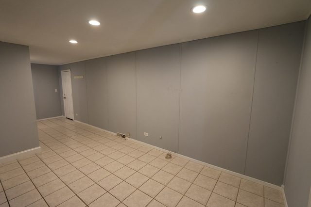 unfurnished room featuring light tile patterned floors