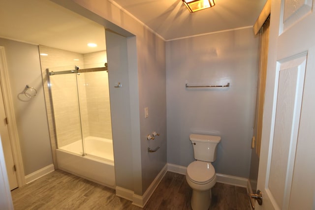 bathroom with shower / bath combination with glass door, wood-type flooring, and toilet