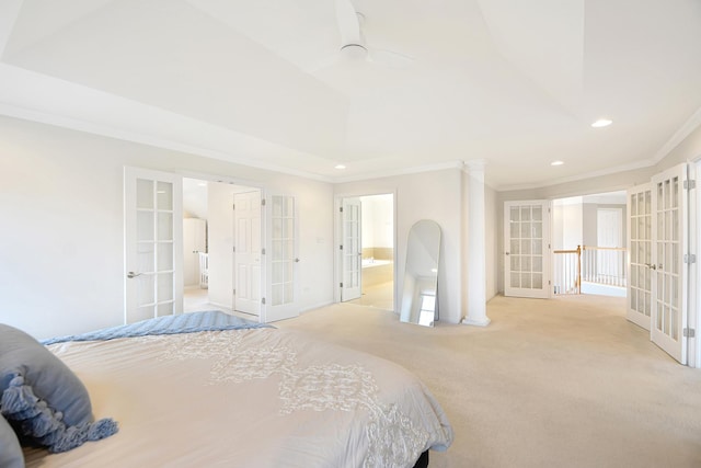 carpeted bedroom with connected bathroom, crown molding, and french doors