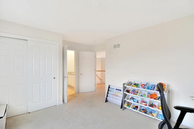 recreation room featuring light carpet