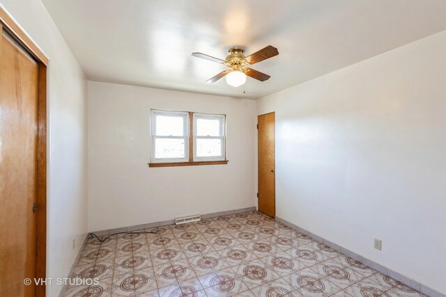 spare room with ceiling fan