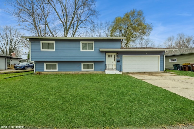 view of front of home featuring a garage and a front lawn