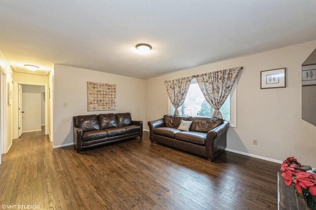 living room with dark hardwood / wood-style floors