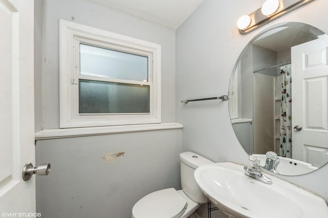 bathroom featuring sink and toilet