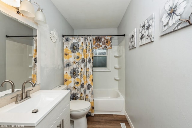 full bathroom featuring shower / bath combination with curtain, vanity, toilet, and hardwood / wood-style floors