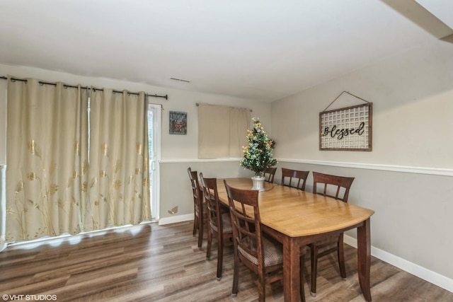 dining area with wood-type flooring