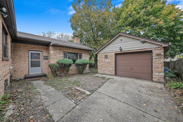 view of front facade featuring an outbuilding and a garage