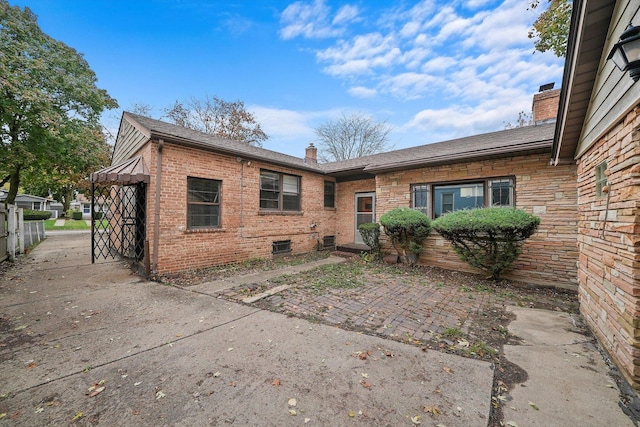 back of property featuring a patio