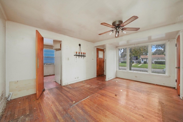 unfurnished room with ceiling fan and hardwood / wood-style floors