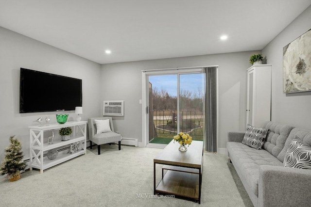 living room featuring an AC wall unit, a baseboard heating unit, and light colored carpet