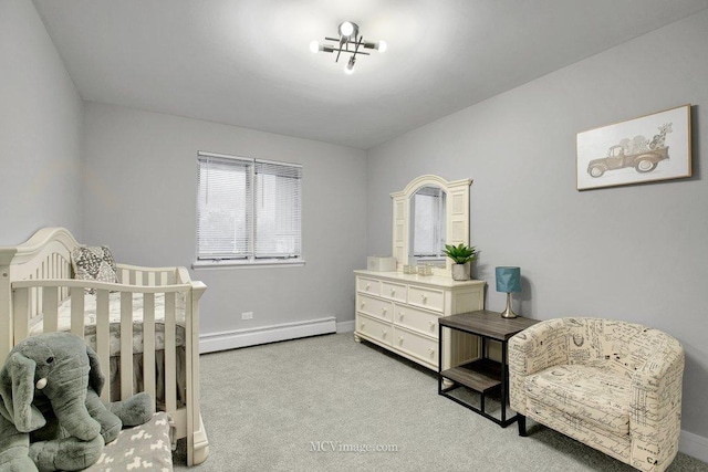 carpeted bedroom featuring a baseboard radiator