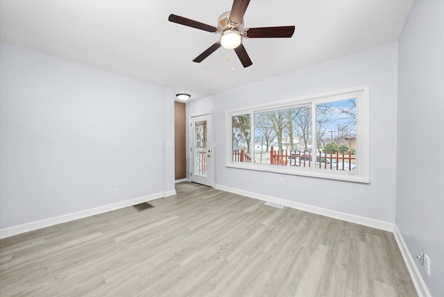 unfurnished room with ceiling fan and light hardwood / wood-style floors