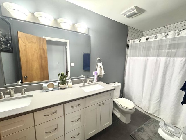 bathroom featuring a shower with curtain, tile patterned floors, vanity, and toilet