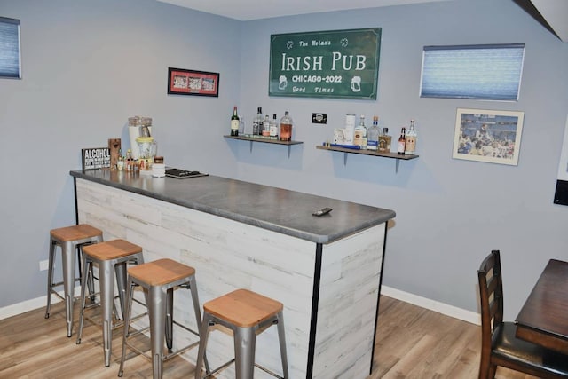 bar with hardwood / wood-style flooring