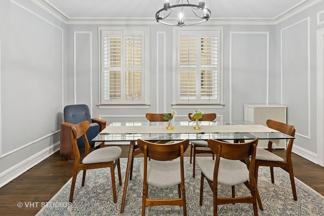 dining space with a chandelier, dark wood-style flooring, plenty of natural light, and crown molding