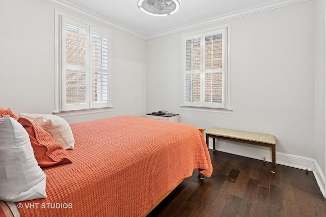 bedroom with ornamental molding, hardwood / wood-style flooring, and baseboards