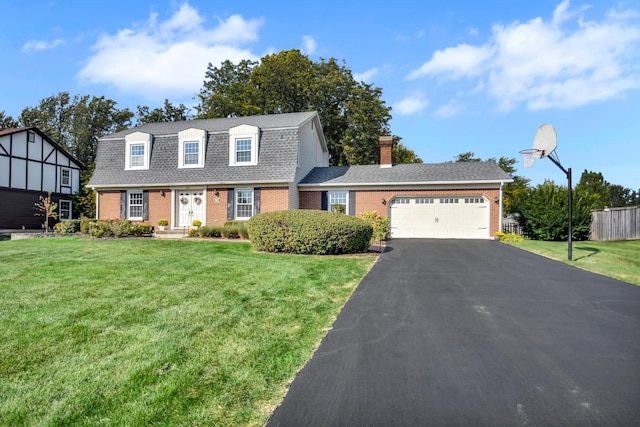 view of front facade with a garage and a front lawn