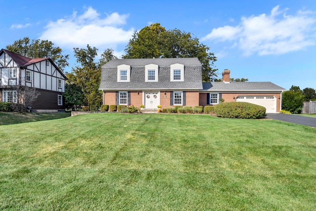 cape cod-style house with a garage and a front lawn