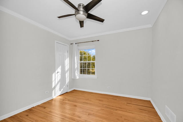 empty room with crown molding, ceiling fan, and light wood-type flooring