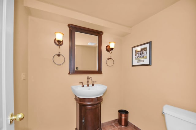 bathroom featuring vanity, tile patterned floors, and toilet