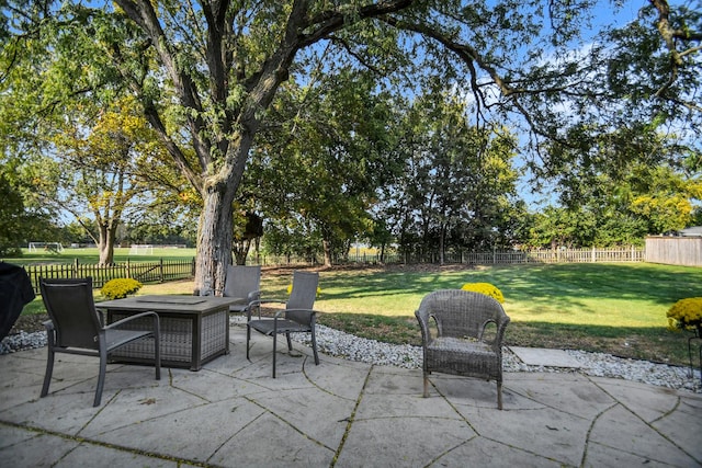 view of patio with a fire pit