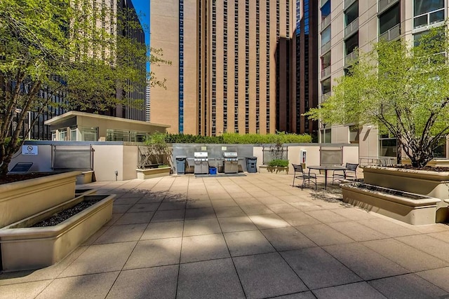 exterior space featuring a city view and grilling area