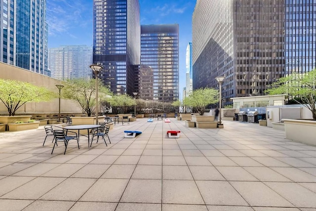 view of home's community with a view of city and a patio