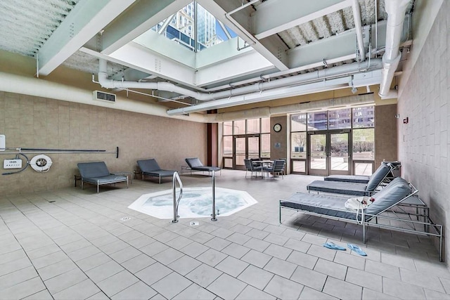 interior space featuring a skylight and french doors