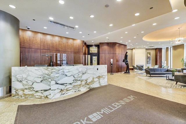 welcome area featuring a chandelier and visible vents