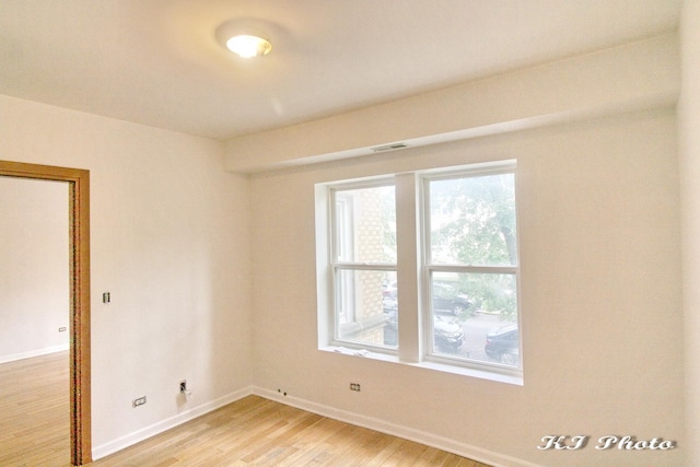 empty room featuring hardwood / wood-style flooring