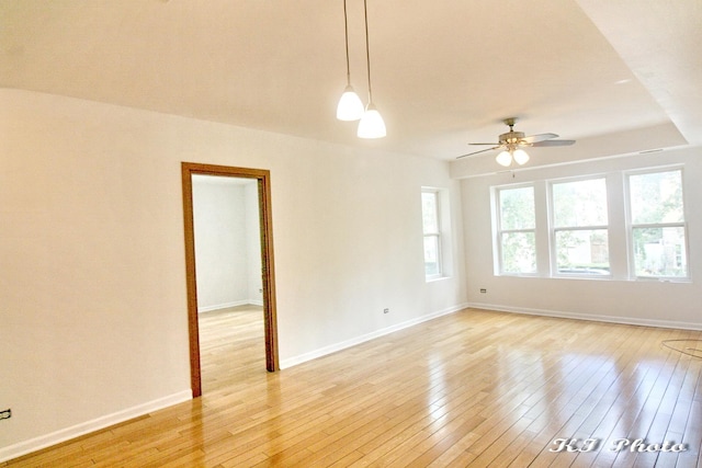 empty room featuring ceiling fan and light wood-type flooring