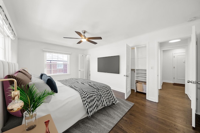 bedroom featuring ceiling fan and dark hardwood / wood-style flooring