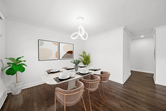 dining space featuring crown molding, dark hardwood / wood-style floors, and an inviting chandelier