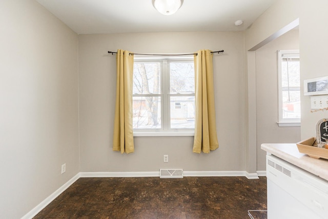 unfurnished dining area with plenty of natural light