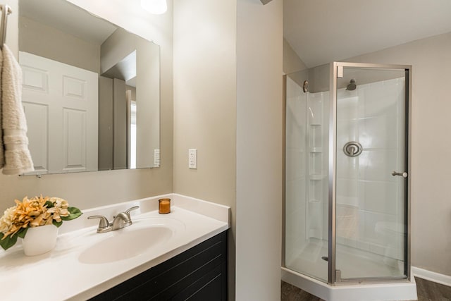 bathroom with vanity and an enclosed shower