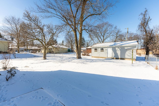 view of yard layered in snow