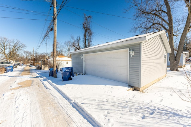 view of snow covered garage