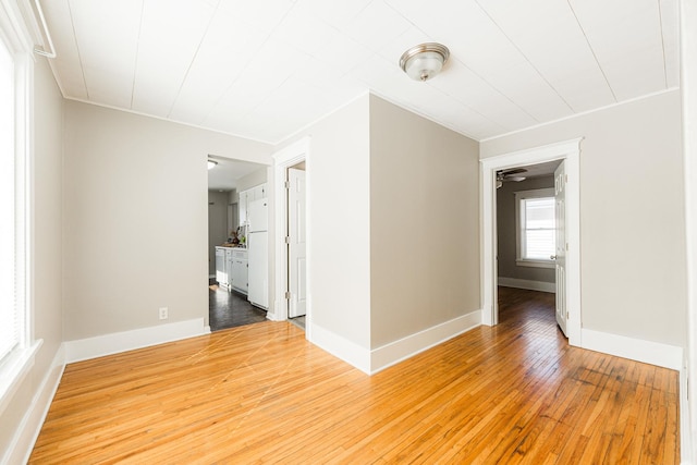 unfurnished room featuring hardwood / wood-style flooring