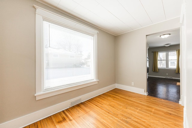 spare room featuring hardwood / wood-style floors