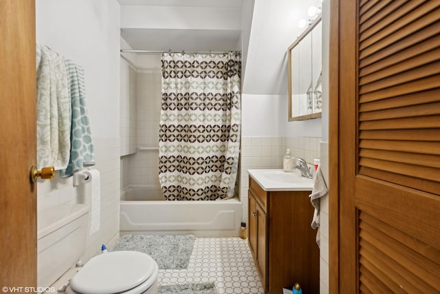 full bathroom featuring tile walls, tile patterned flooring, vanity, shower / bath combination with curtain, and toilet