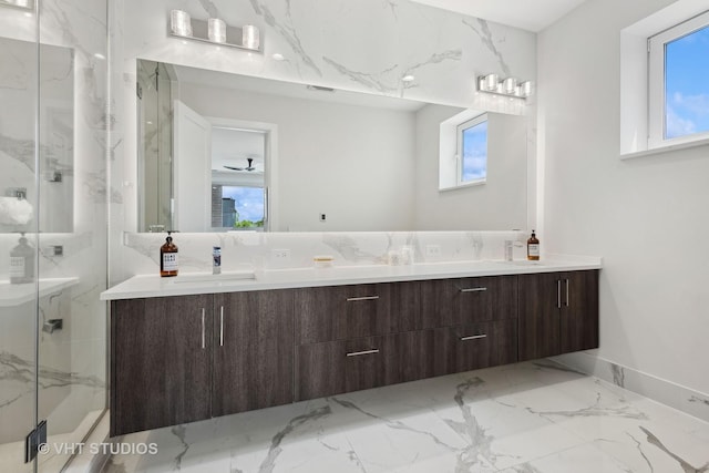 bathroom featuring vanity and a shower with door